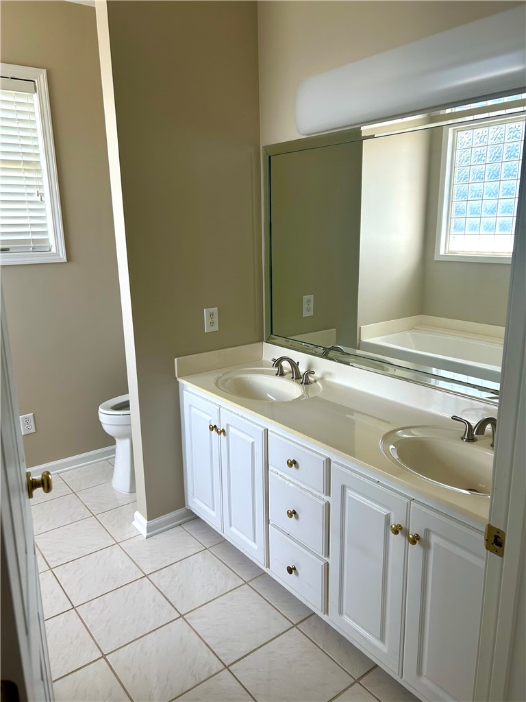 116 Buttercup Trail Anderson, SC 29621 - Photo 21 of 49 This bright bathroom features a spacious dual vanity and pristine tiled flooring.