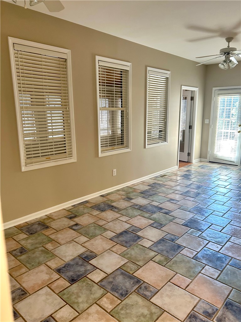 116 Buttercup Trail Anderson, SC 29621 - Photo 24 of 49 This bright space features a patterned tile floor and ample natural light through multiple windows.
