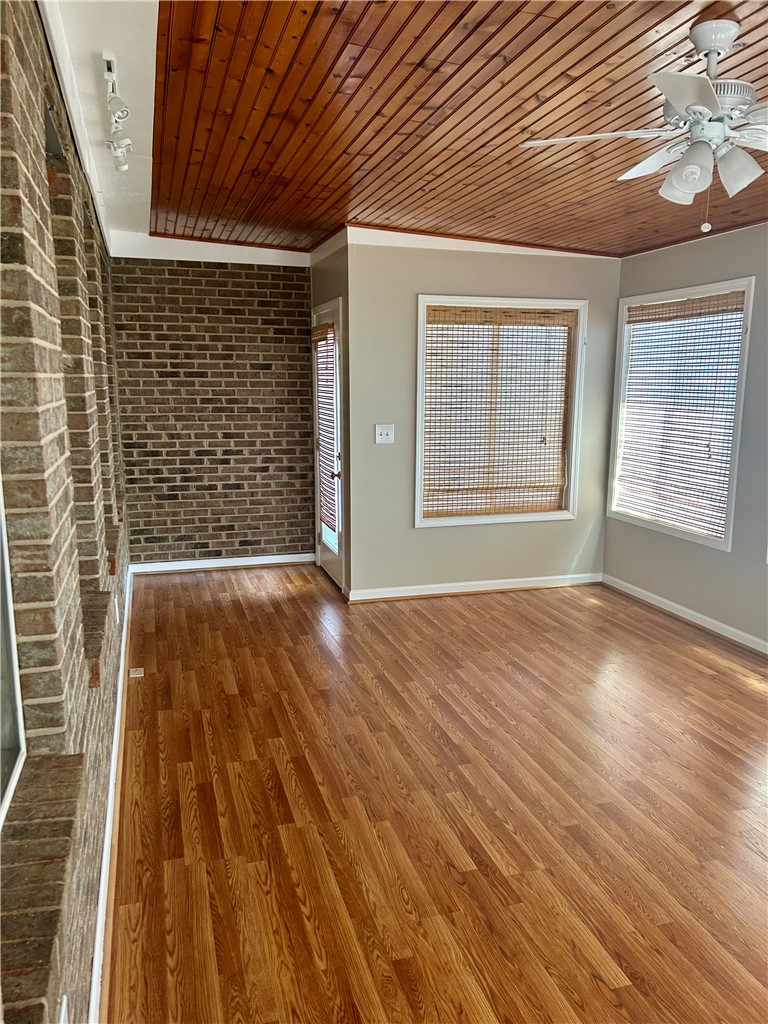 116 Buttercup Trail Anderson, SC 29621 - Photo 27 of 49 This versatile room features warm wood flooring and a charming brick accent wall, ideal for any lifestyle.