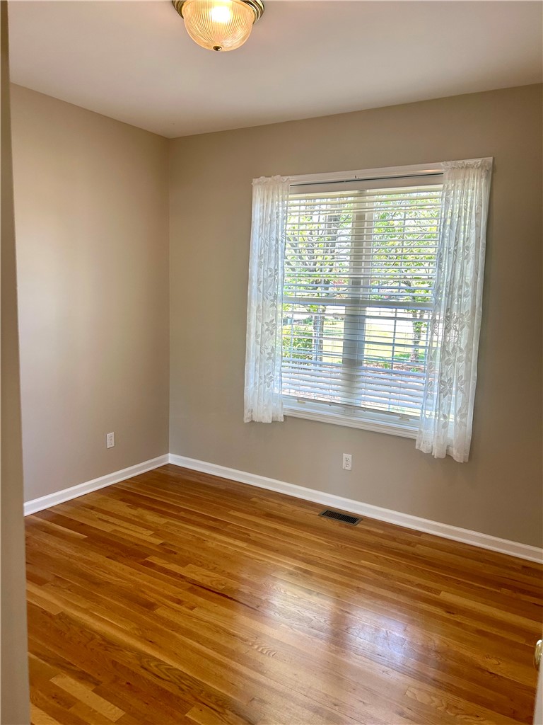 116 Buttercup Trail Anderson, SC 29621 - Photo 33 of 49 This bright room features beautiful hardwood floors and ample natural light through a large window.