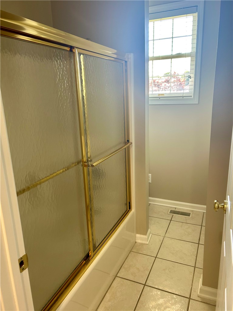 116 Buttercup Trail Anderson, SC 29621 - Photo 34 of 49 This bathroom features a shower-tub combination and ample natural light.