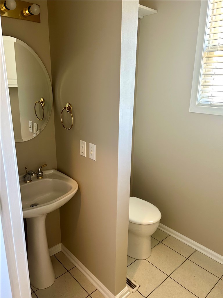 116 Buttercup Trail Anderson, SC 29621 - Photo 39 of 49 This bathroom features a classic pedestal sink and toilet, offering practical design.