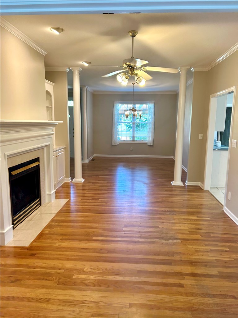 116 Buttercup Trail Anderson, SC 29621 - Photo 4 of 49 Warm hardwood floors and a cozy fireplace create an inviting living space.
