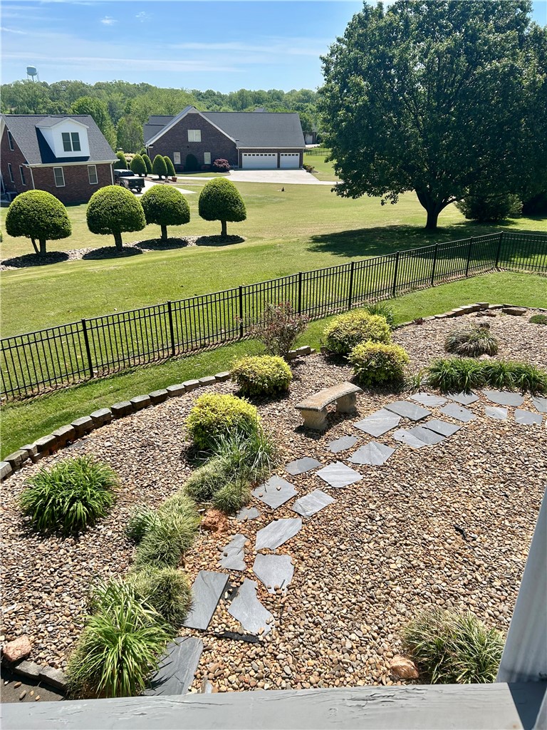 116 Buttercup Trail Anderson, SC 29621 - Photo 42 of 49 This expansive yard features meticulously maintained landscaping and a functional, attractive fence.