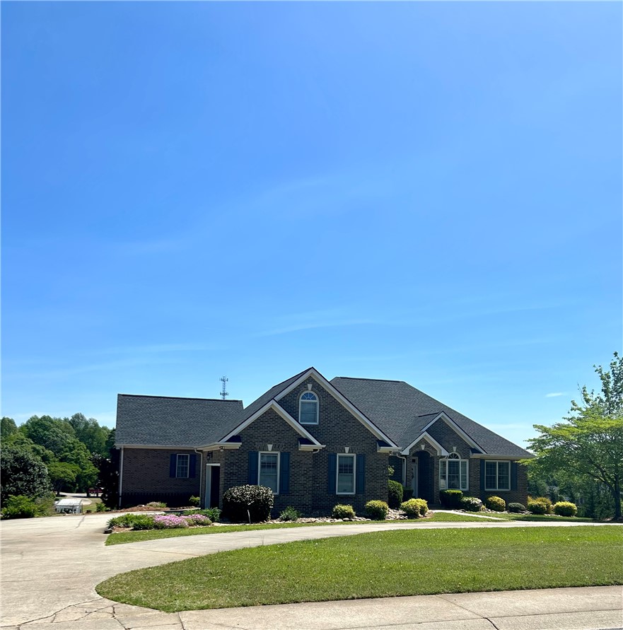 116 Buttercup Trail Anderson, SC 29621 - Photo 49 of 49 This classic brick residence boasts a neatly manicured lawn and a welcoming driveway.