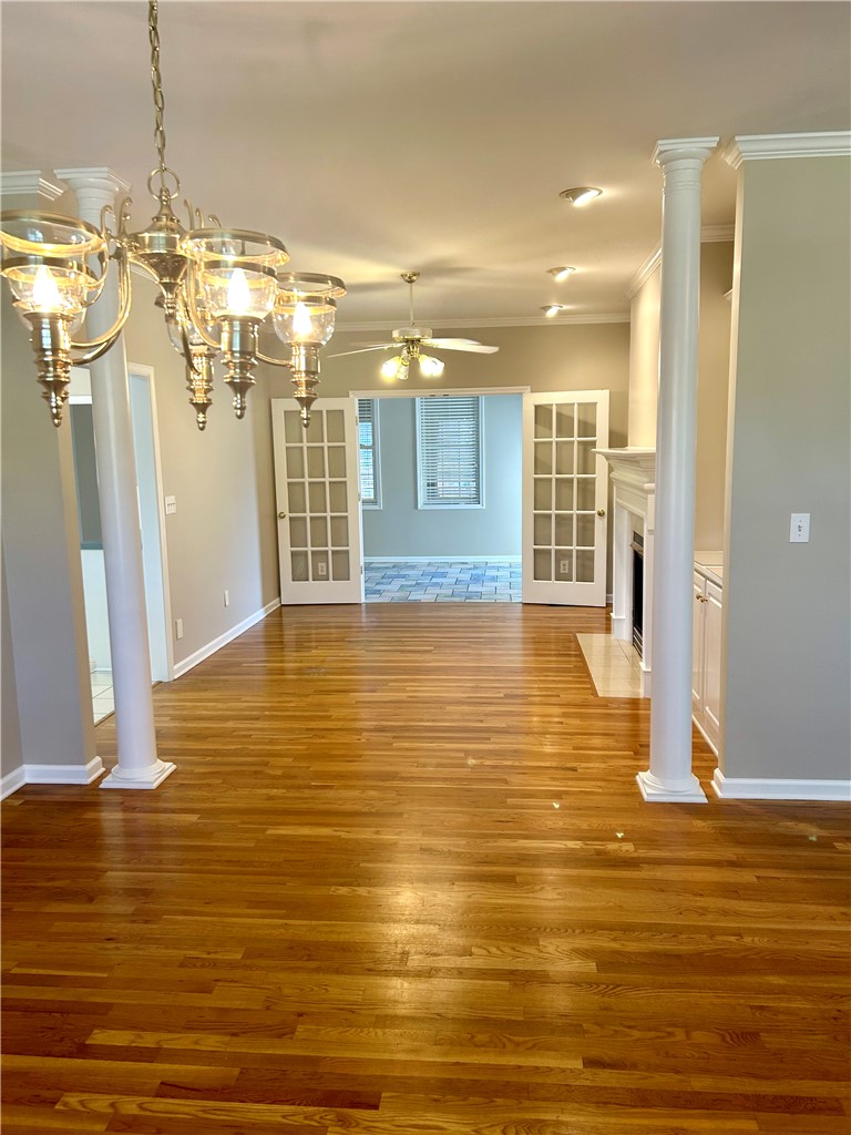 116 Buttercup Trail Anderson, SC 29621 - Photo 5 of 49 This inviting space features elegant hardwood flooring and a classic chandelier, perfect for entertaining.