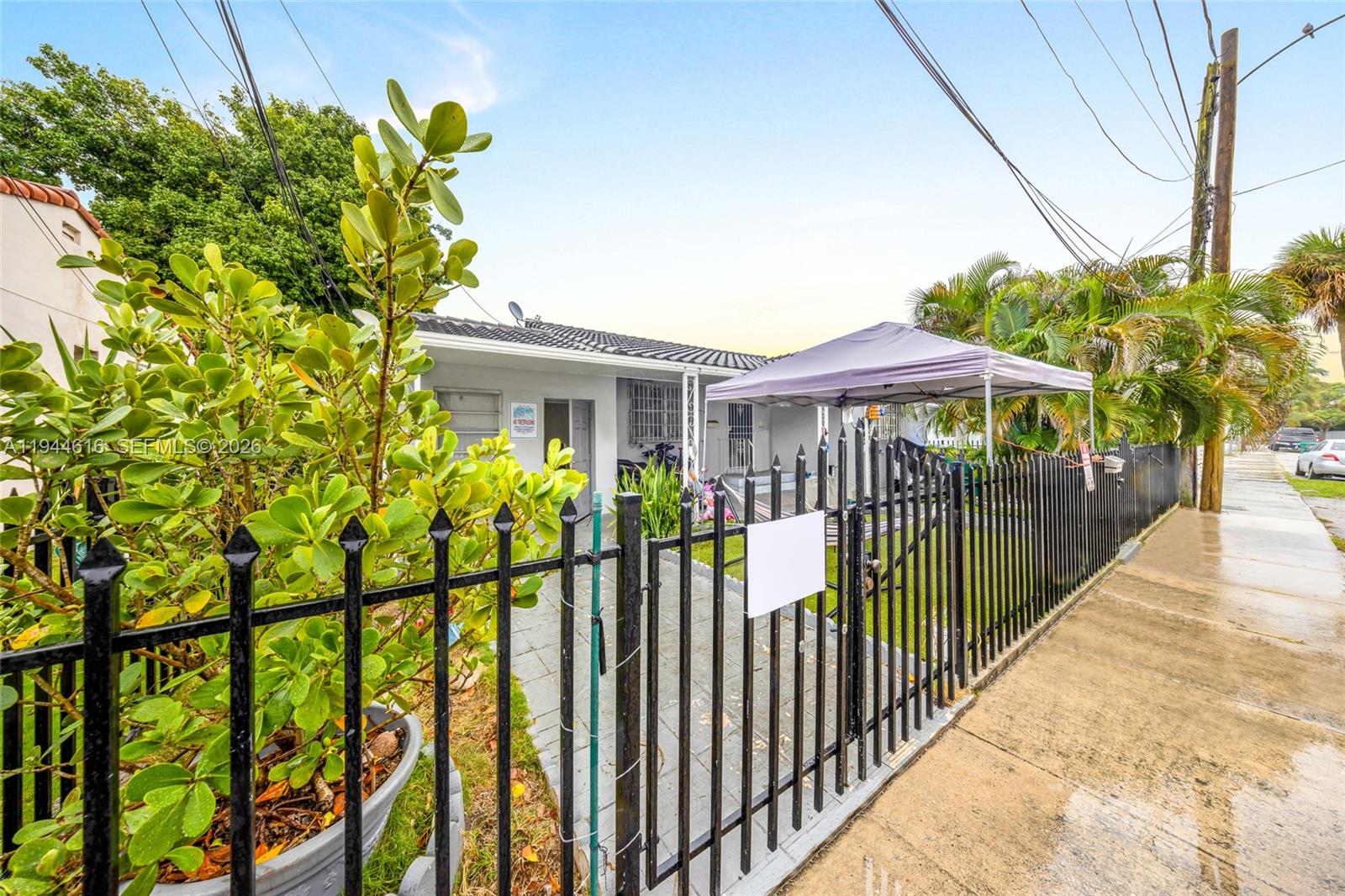943 Southwest 9th Avenue Miami, FL 33130 - Photo 3 of 16 a view of a garden with wooden fence