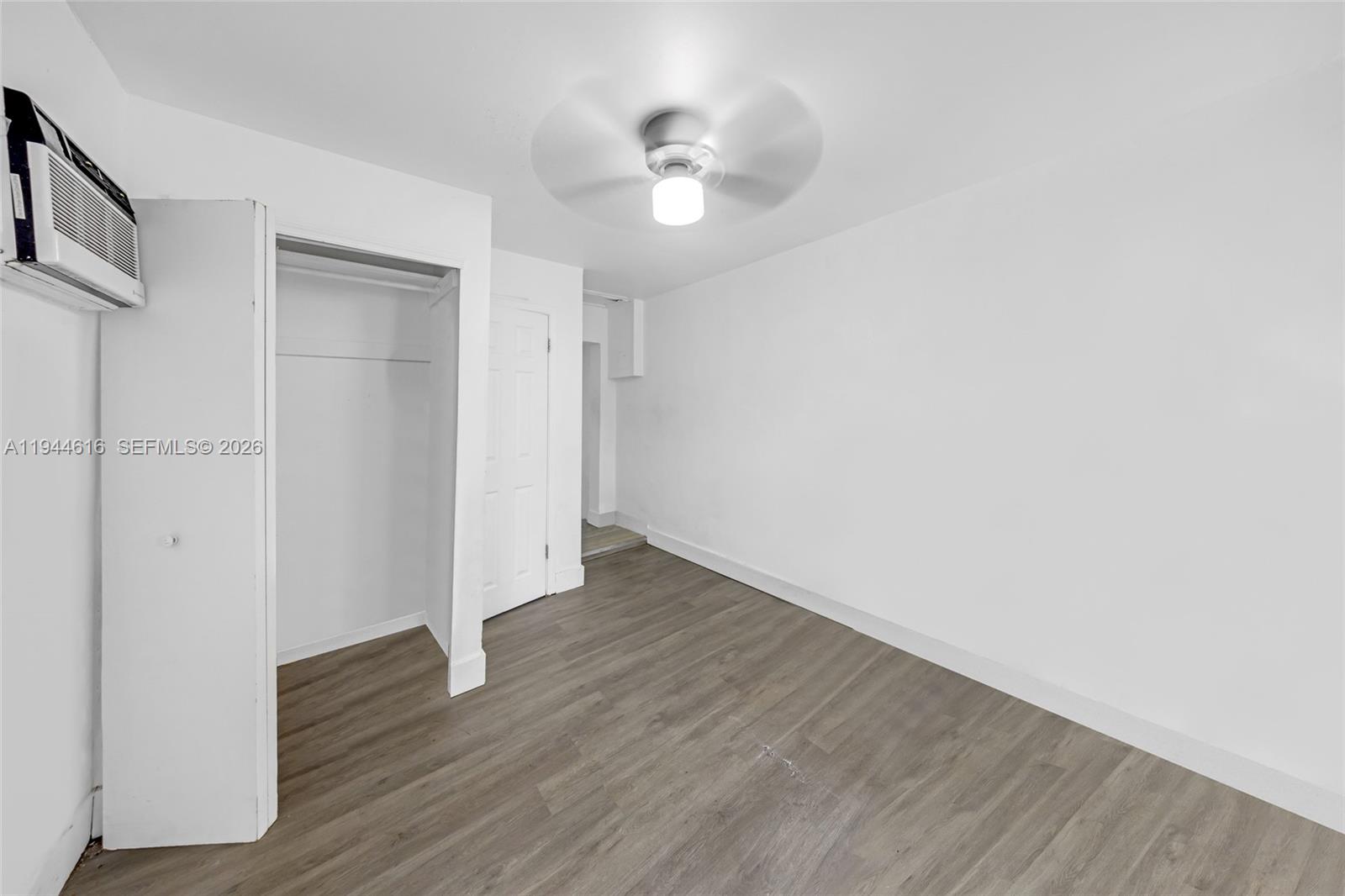 943 Southwest 9th Avenue Miami, FL 33130 - Photo 6 of 16 a view of an empty room with wooden floor