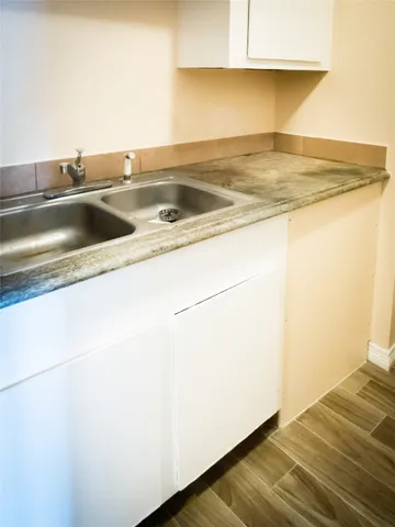 a view white cabinets and sink