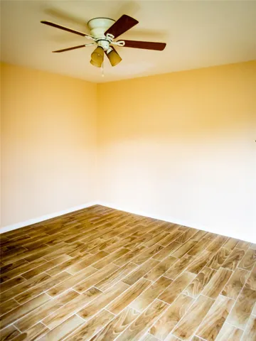 a view of a big room with wooden floor