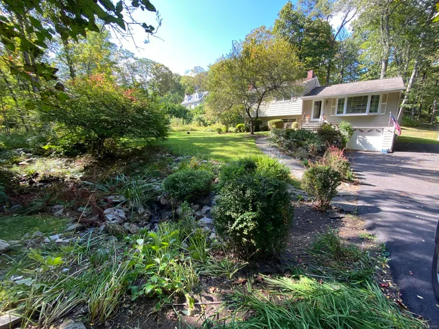 a house view with a garden space