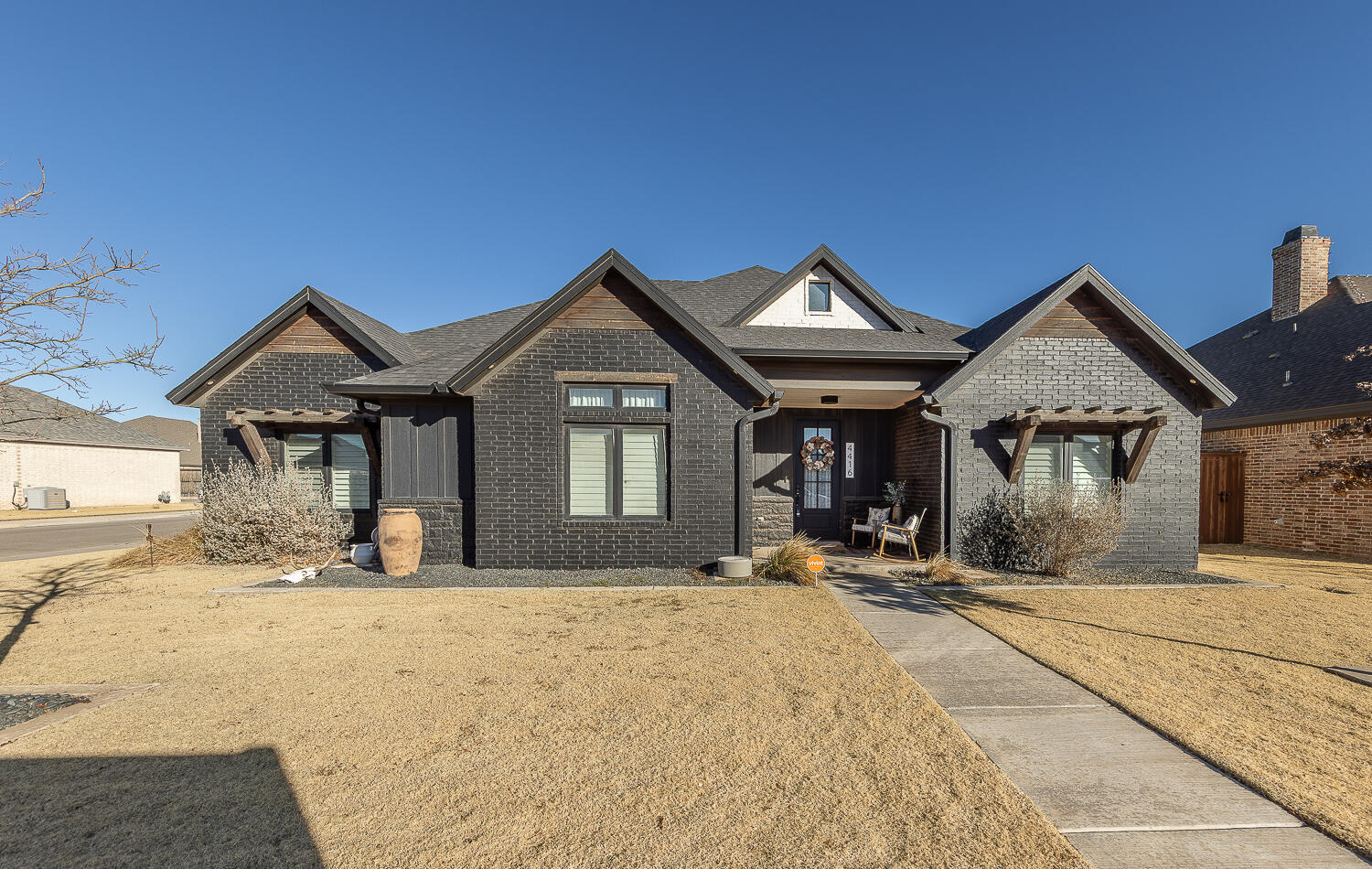 4416 140th Street Lubbock, TX 79424 - Photo 1 of 36 a front view of a house with a yard