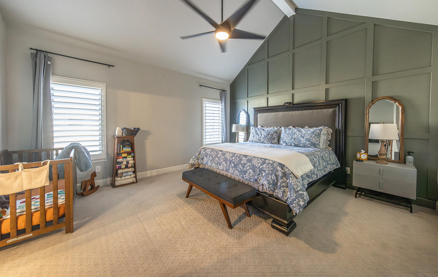 4416 140th Street Lubbock, TX 79424 - Photo 13 of 36 a bedroom with a bed and a chandelier