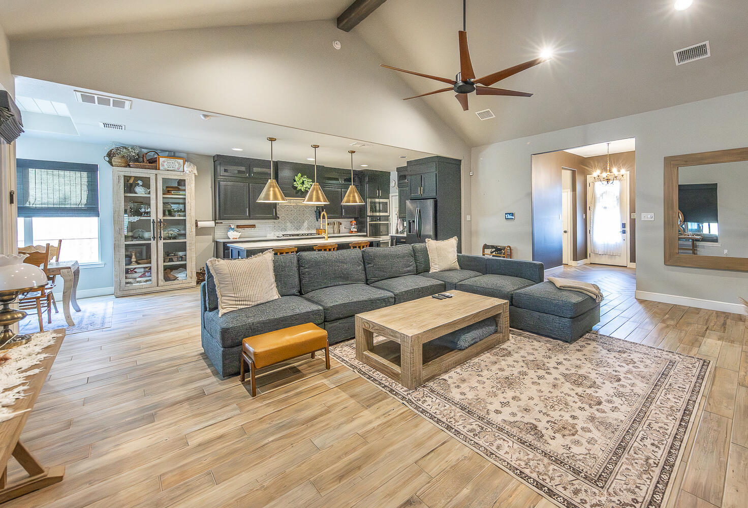 4416 140th Street Lubbock, TX 79424 - Photo 2 of 36 a living room with furniture ceiling fan and a rug