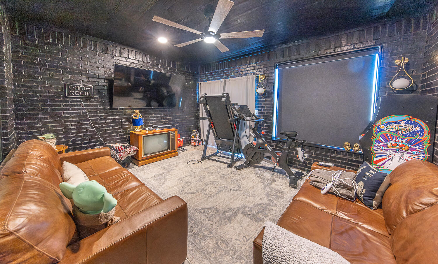 4416 140th Street Lubbock, TX 79424 - Photo 29 of 36 a view of a livingroom with furniture and a flat screen tv