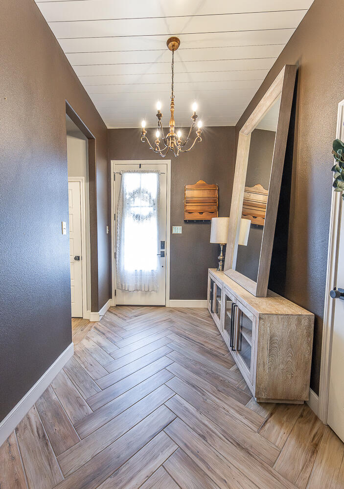 4416 140th Street Lubbock, TX 79424 - Photo 5 of 36 a view of a livingroom with wooden floor and stairs