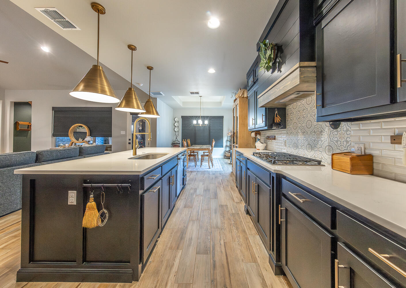 4416 140th Street Lubbock, TX 79424 - Photo 10 of 36 a kitchen with stainless steel appliances granite countertop a sink a stove and a refrigerator