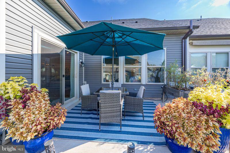 1008 Campbell Way Hatfield, PA 19440 - Photo 29 of 33 a view of a patio with couches table and chairs and potted plants