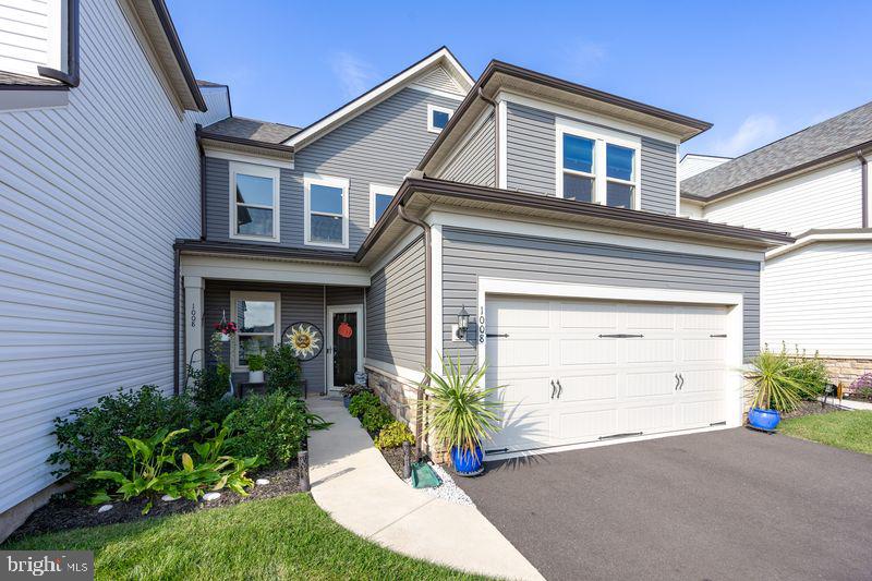 1008 Campbell Way Hatfield, PA 19440 - Photo 3 of 33 a front view of a house with a yard and garage