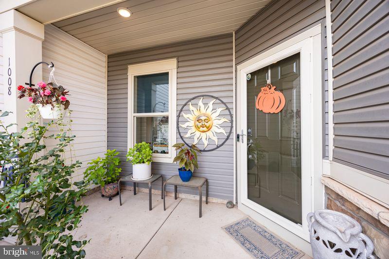 1008 Campbell Way Hatfield, PA 19440 - Photo 4 of 33 a potted plant sitting in front of a door