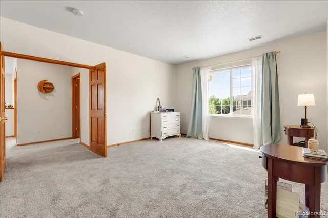 a view of a livingroom with a workspace