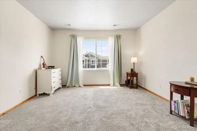 a view of a room with window and a livingroom with furniture