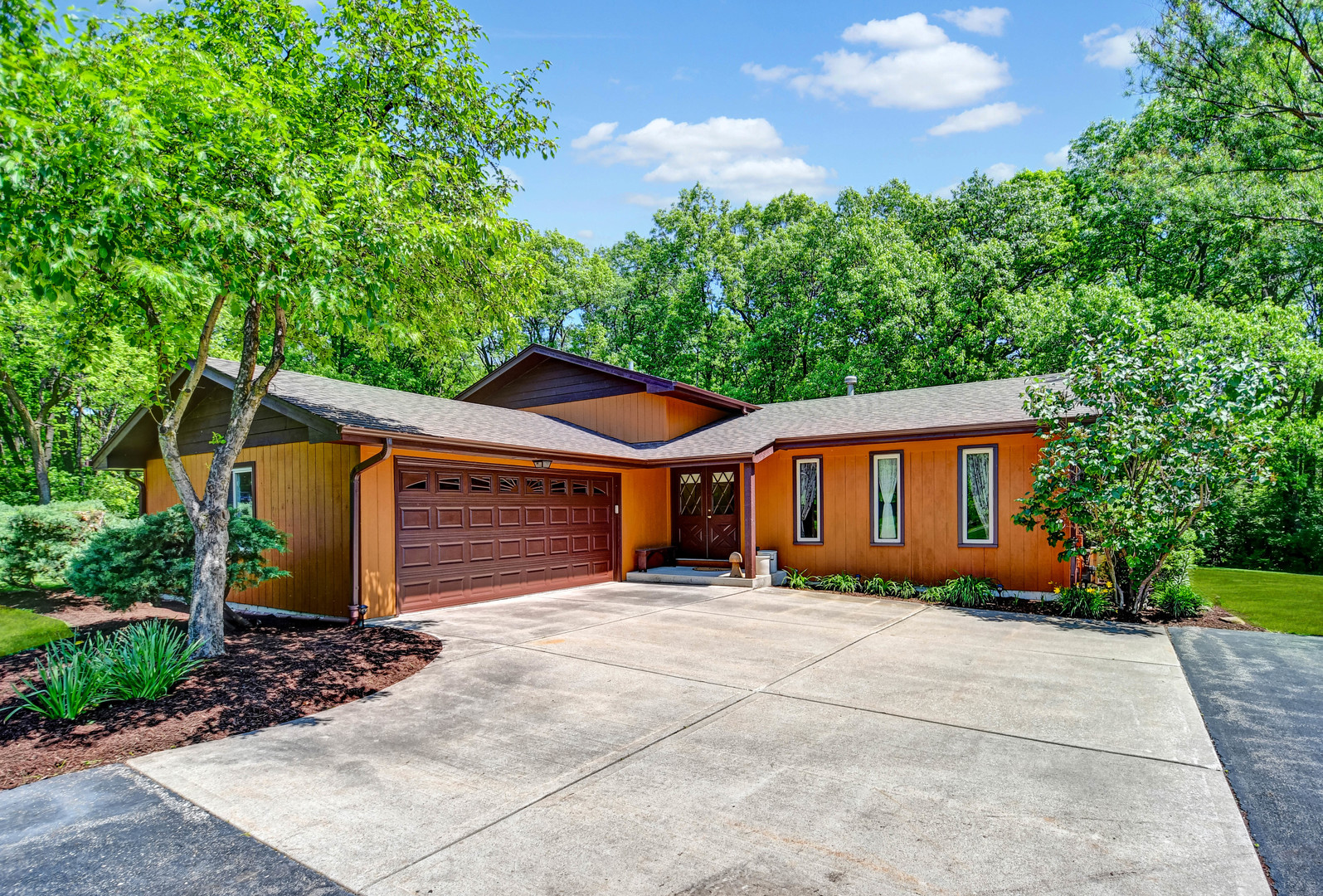 17342 Bluff Road Lemont, IL 60439 - Photo 1 of 32 a front view of a house with a yard and potted plants
