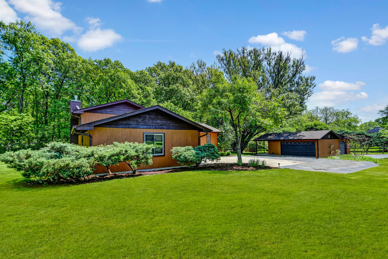 17342 Bluff Road Lemont, IL 60439 - Photo 20 of 32 a view of a house with a yard potted plants and a large tree