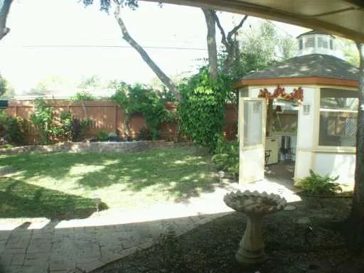 a backyard of a house with lots of green space