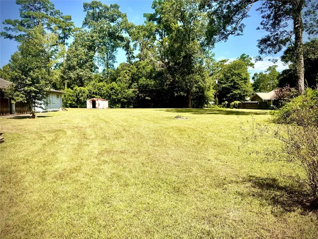 a view of a swimming pool with an outdoor space and seating area