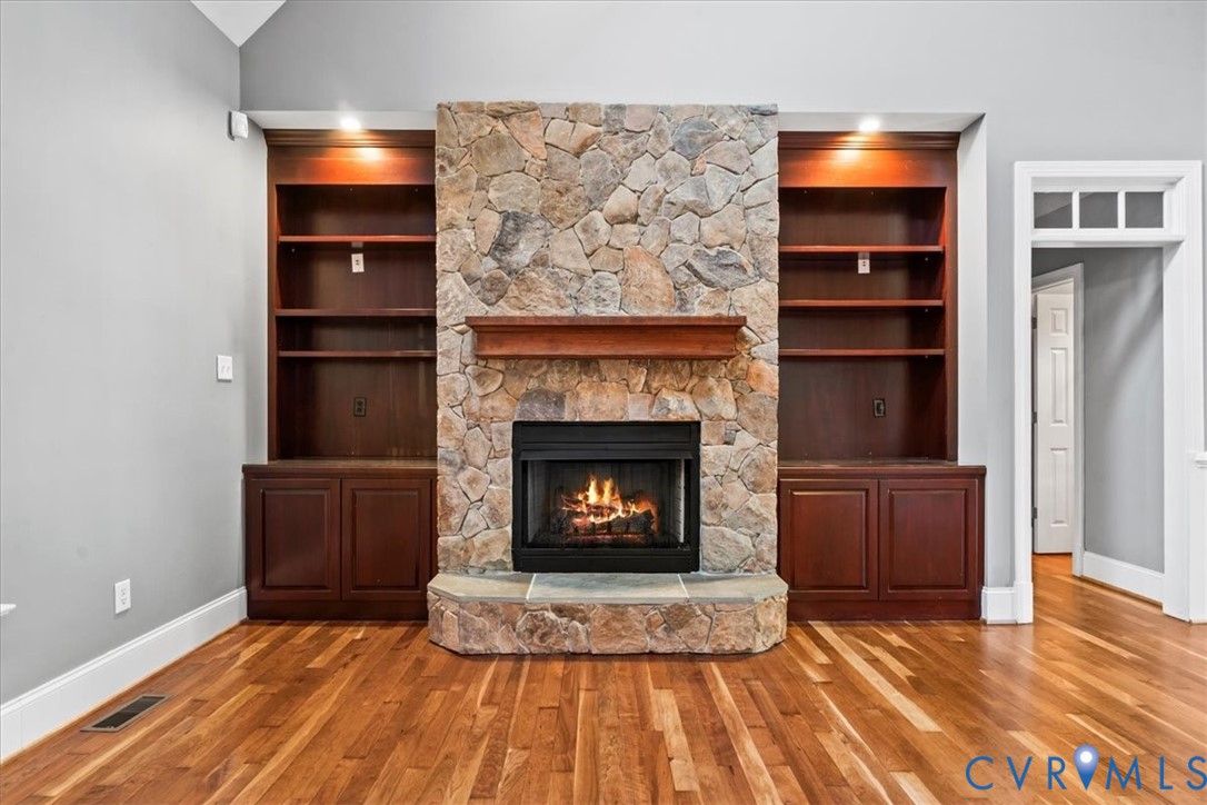 3308 Yarding Way Toano, VA 23168 - Photo 30 of 83 a living room with a fireplace and a wooden floor