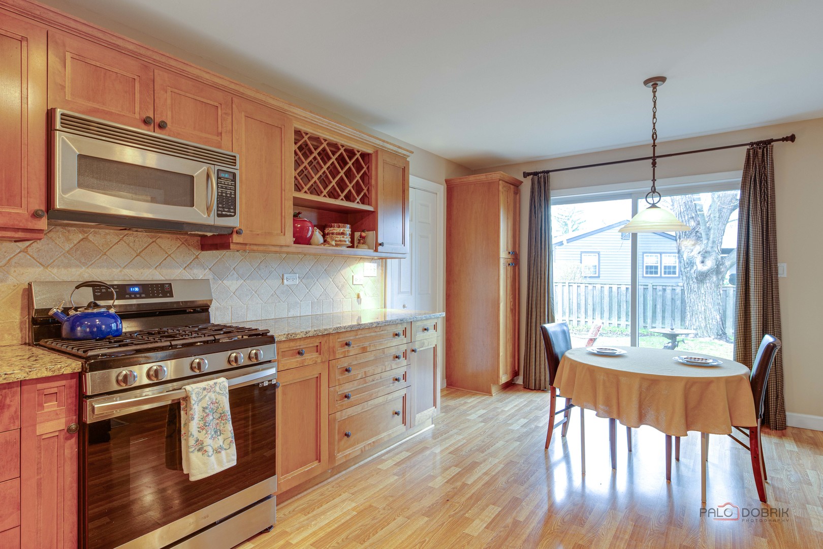 441 Arbor Gate Lane Buffalo Grove, IL 60089 - Photo 15 of 29 a kitchen with stainless steel appliances granite countertop a stove a sink and a wooden cabinets