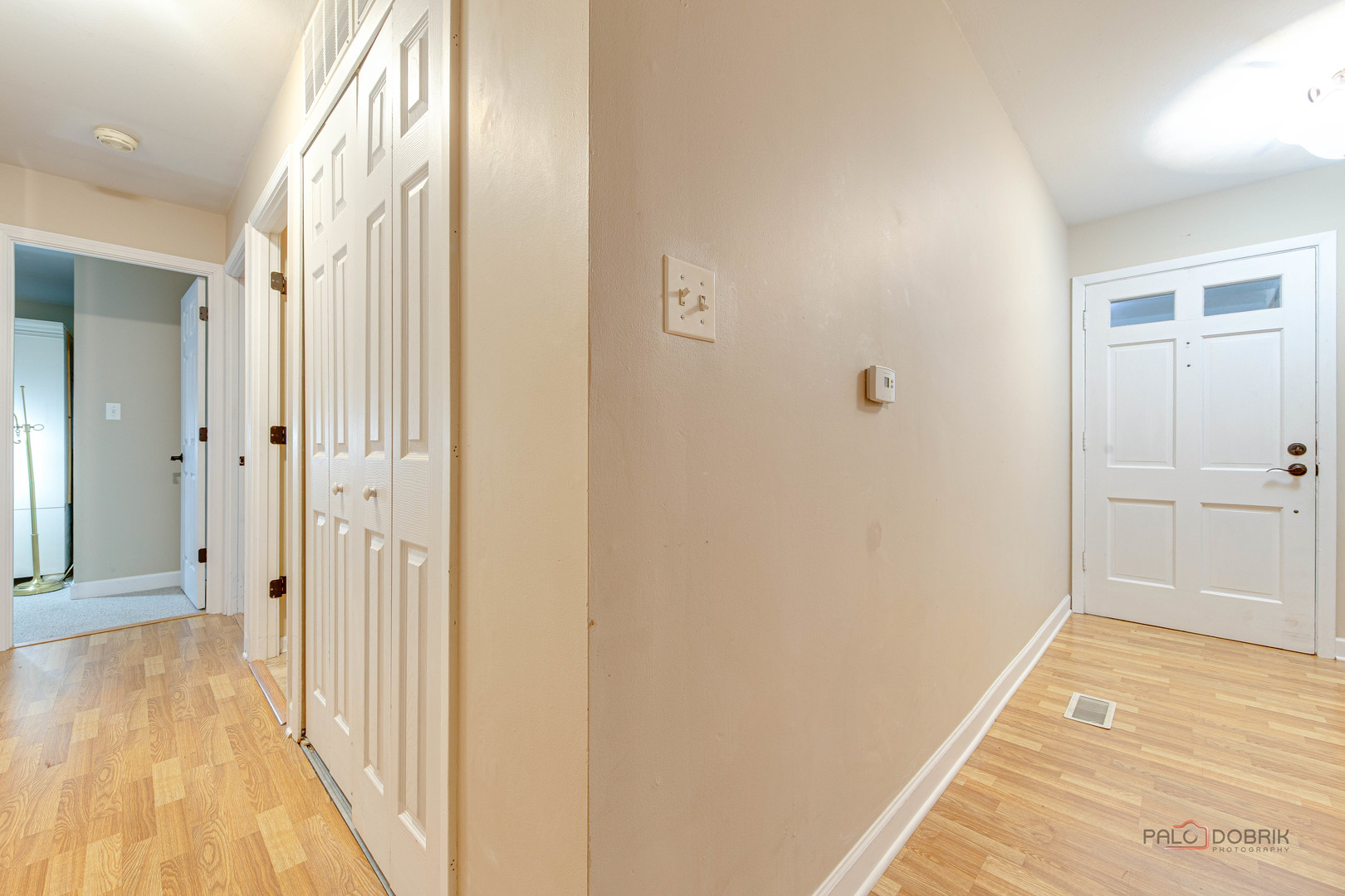 441 Arbor Gate Lane Buffalo Grove, IL 60089 - Photo 4 of 29 a view of a hallway with wooden floor and closet