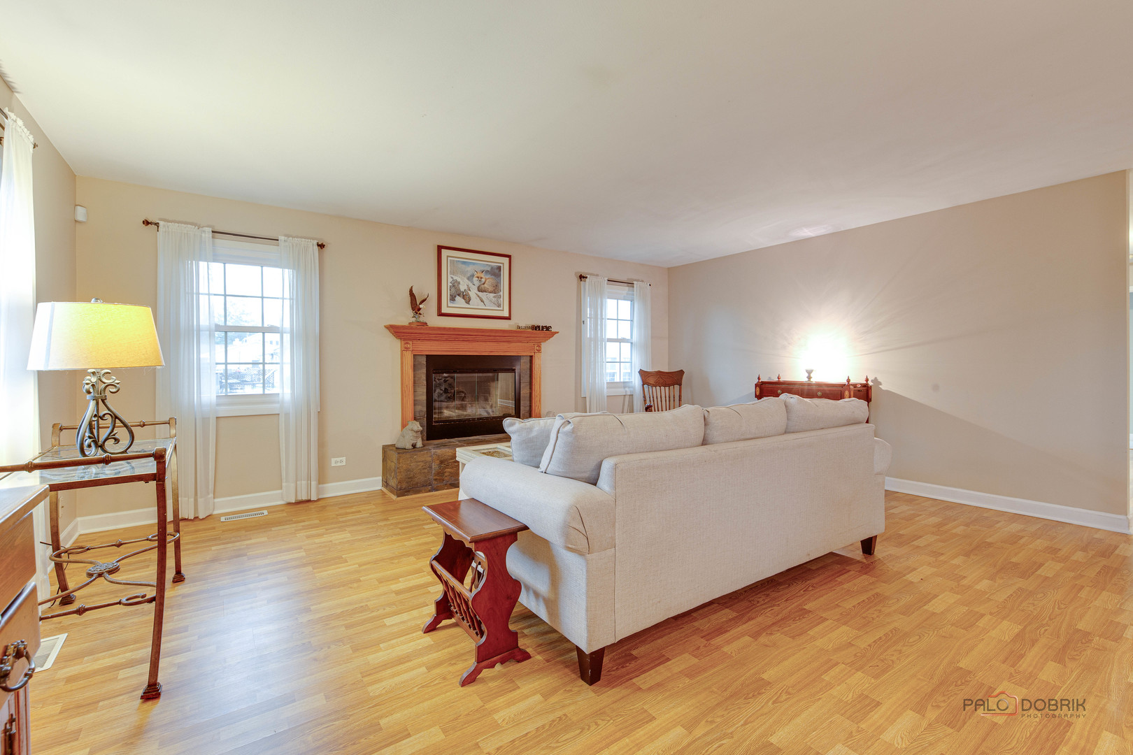 441 Arbor Gate Lane Buffalo Grove, IL 60089 - Photo 7 of 29 a living room with furniture a fireplace and a lamp