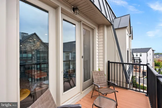 a view of a balcony with furniture