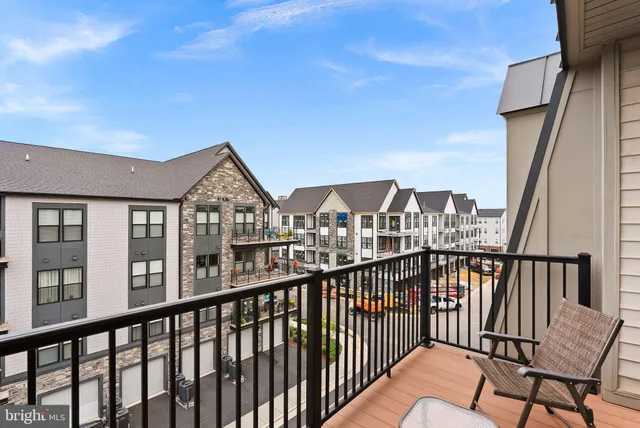 a view of a houses from a balcony