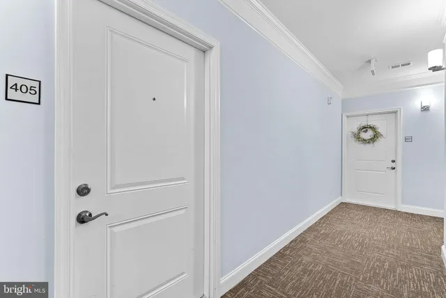 a view of a hallway with closet area