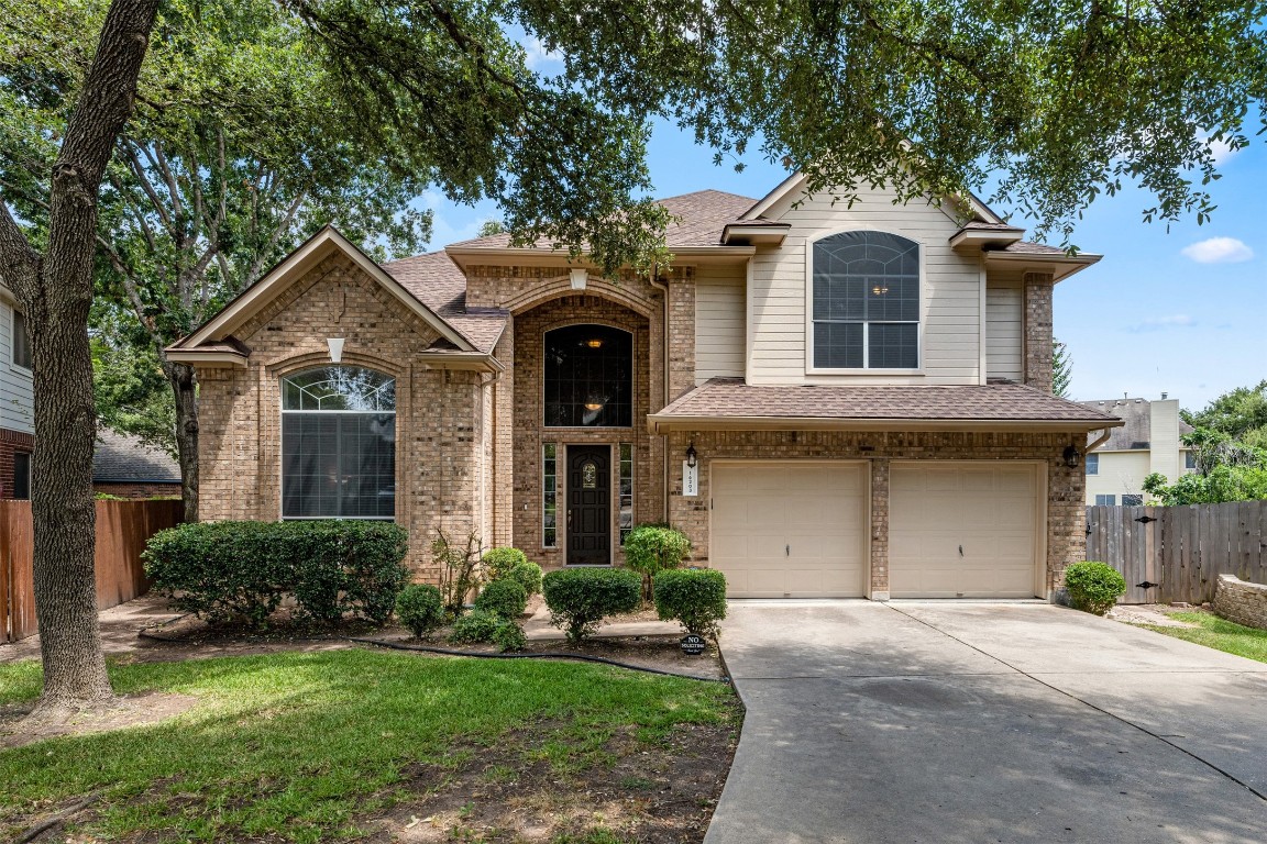 Undisclosed Address Austin, TX 78717 - Photo 1 of 1 a front view of a house with a garden