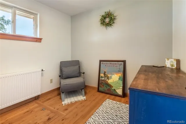 a bedroom with furniture and a window