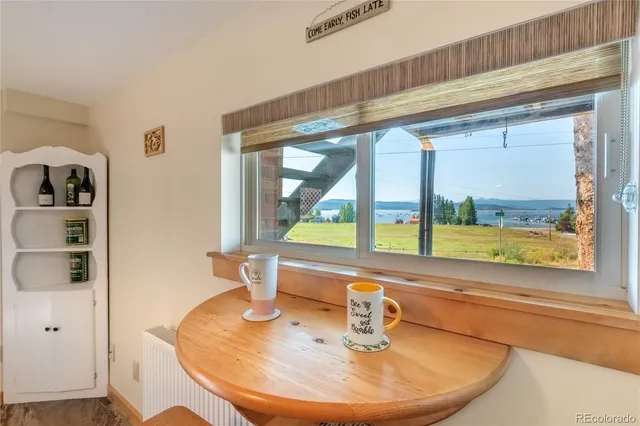 a view of a living room with a large window