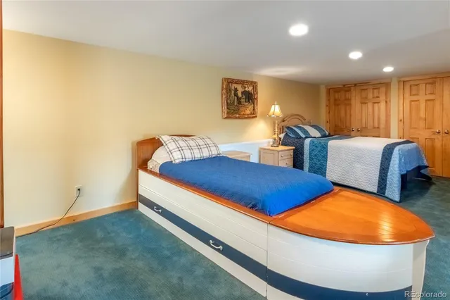 a room with wooden floor and furniture