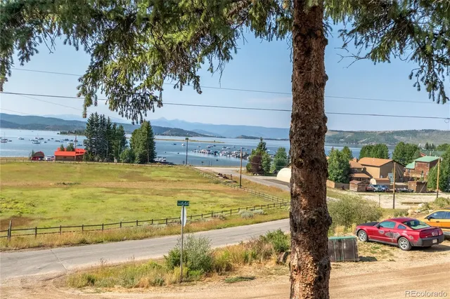 a swimming pool with outdoor seating and yard