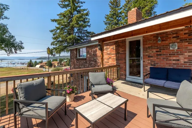 a view of a chairs and table in the patio