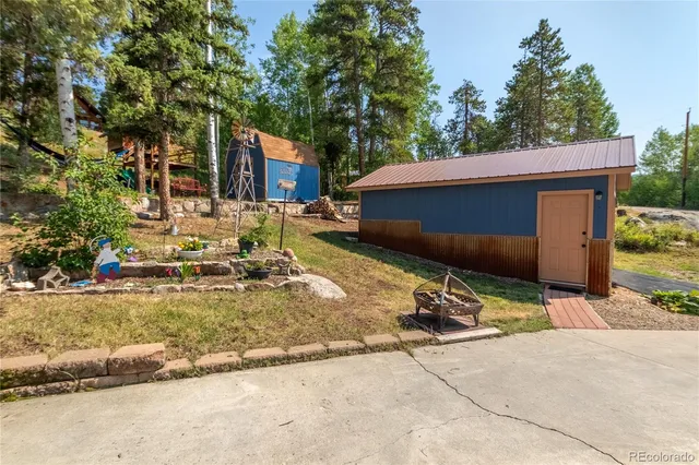 a view of a house with backyard porch and sitting area