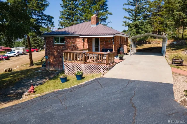 a view of a chairs and table in the patio