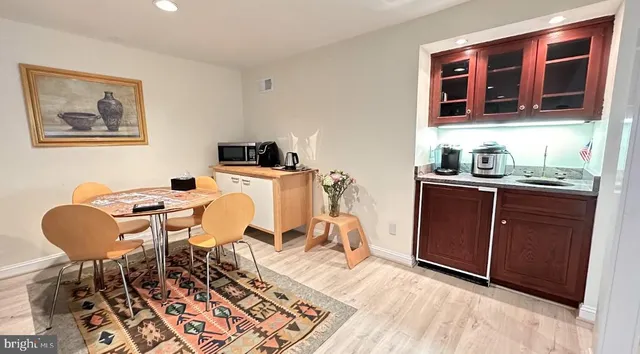 a living room with granite countertop furniture a rug and a window