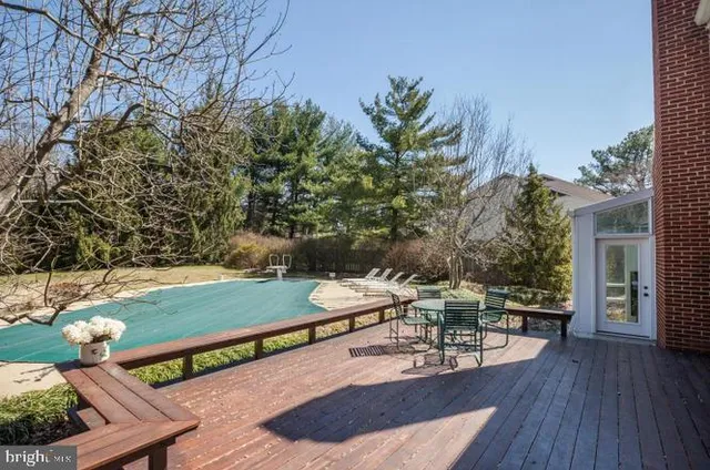 a view of a chairs and table in patio
