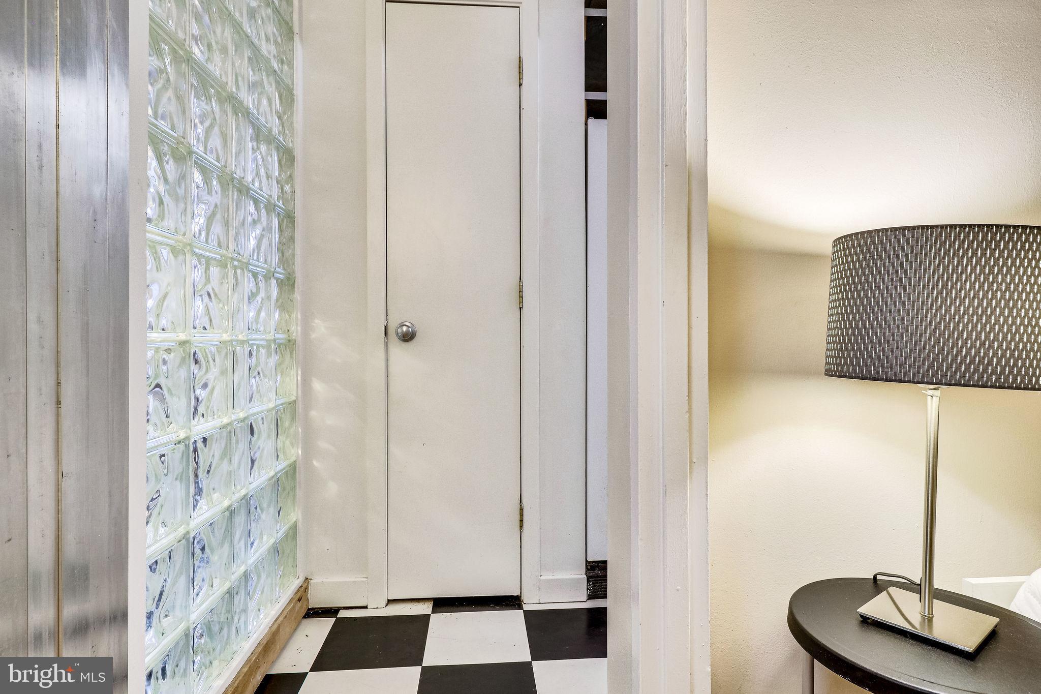 1111 Arlington Boulevard, Unit 812 Arlington, VA 22209 - Photo 19 of 37 a view of a bedroom with wooden floor and a potted plant