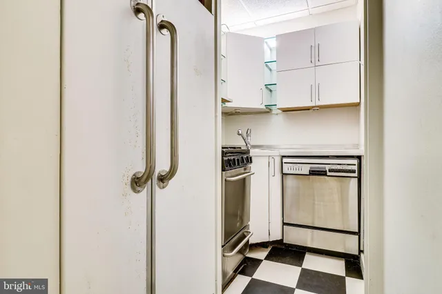 a kitchen with a stove and a microwave