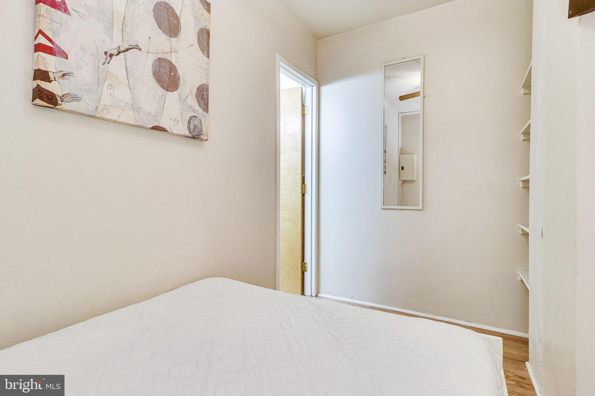 1111 Arlington Boulevard, Unit 812 Arlington, VA 22209 - Photo 27 of 37 a bedroom with a bed and a window